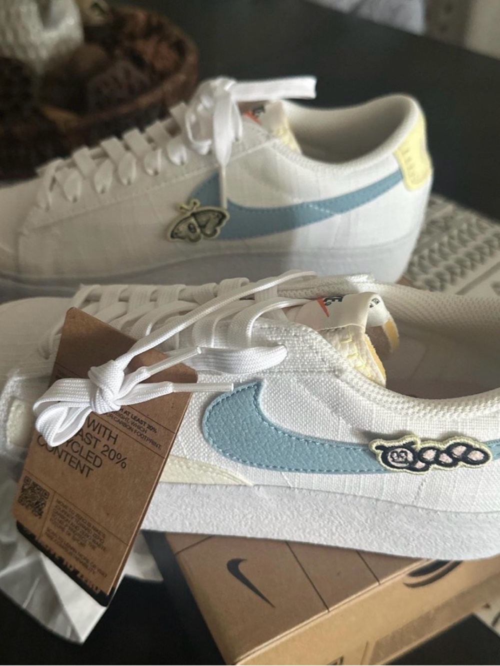 Nike Women's White Sneakers with Light Blue Swoosh and Yellow Heel Tab